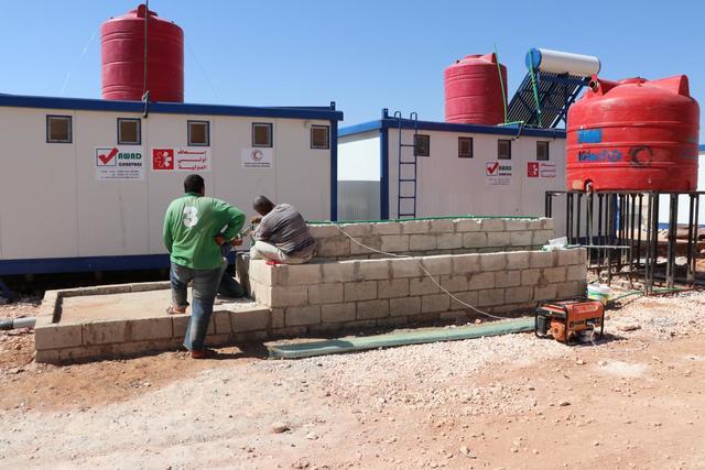 Bau einer Wasserstation mit Waschplatz
